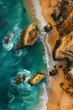 Aerial snapshot captures the stunning contrast of Algarve's rocky shores against the vibrant turquoise waters in Portugal.