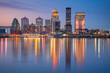 Louisville, Kentucky, USA. Cityscape image of Louisville, Kentucky, USA downtown skyline with reflection of the city the Ohio River at spring sunrise.