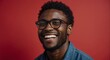 Portrait of attractive handsome nerdy black african guy optimistic happy laughing on plain bright black background from Generative AI