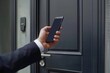 Hand man closely with the phone, the businessman uses the application on the smartphone to remove the door opening of the house, office, Generative AI