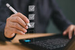 © FON's Fasai - Business performance summary checklist review, businessman with computer online evaluate checklist survey, fill digital report form as assessment, questionnaire, evaluation, check online survey