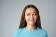 © fotofabrika - Disgusted and frowning young woman on gray background