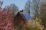 Fototapeta Natura - Photovoltaic plant on the roof of a single family home, solar energy ,  rising energy prices
