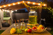 Drink station for an outdoor party. Abstract Night Festival in garden with bokeh for background usage.