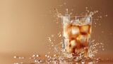 Fototapeta  - A glass of iced coffee with milk being poured in, capturing the swirls, set against the right side of the frame, with the left side showcasing a neutral-toned background ready for text 