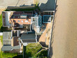 Drone top down view of a new coastal house in the shape of a lighthouse seen next to the beach at a popular Suffolk seaside town of Aldeburgh, Suffolk.