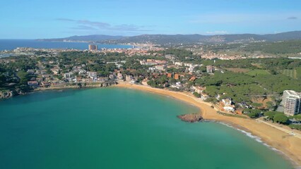 Wall Mural - Aerial views of La Fosca showcase the rugged cliffs and crystal-clear waters that make it a must-visit destination in Catalunya.
