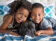 Stunning high resolution photo of a 5 year old African American girl, a 4 year old Caucasian boy and their beloved French bulldog fooling around in the bedroom.