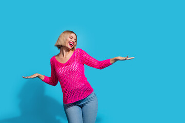 Sticker - Photo portrait of pretty young girl dance clubbing have fun dressed stylish pink knitwear outfit isolated on blue color background