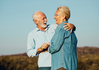 Wall Mural - woman man outdoor senior couple happy lifestyle retirement together smiling love old nature mature