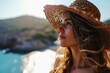 © useful pictures - Beautiful blonde young woman on summer vacation at sunny day. Low angle view portrait of happy female person with straw hat against blue sky and tropical sea background with mountains