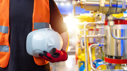 Poster - Man with hardhat in hand. Industrialist holds protective helmet. Engineer near industrial equipment. Cropped engineer with hardhat. Worker with white helmet. Hardhat for protection against injury