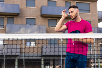 Wall Mural - Pickleball Player Wiping Sweat During Game