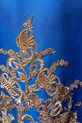 Wall Mural - Gold embroidery on the royal dress.