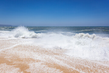 Sticker - North Beach famous for giant waves in Nazare town on so called Silver Coast, Oeste region of Portugal