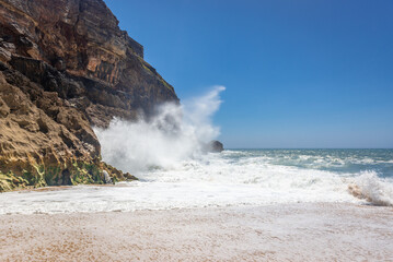 Sticker - Rocks and waves on North Beach famous for giant waves in Nazare town on so called Silver Coast, Oeste region of Portugal