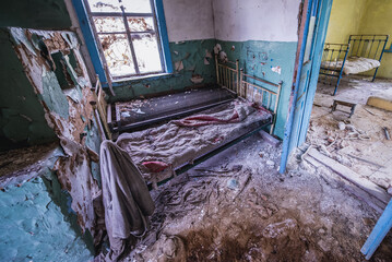 Sticker - Beds in old cottage in abandoned Stechanka village in Chernobyl Exclusion Zone, Ukraine