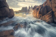 Dramatic view of crashing waves, ocean, rocks and rocky coastline at sunset in Victoria, Australia