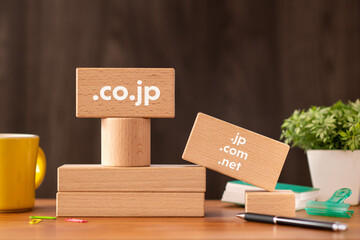 There is wood block with the word .co.jp or. It is as an eye-catching image.