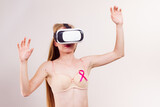 Fototapeta Na sufit - Girl in bra pink cancer ribbon and vr box