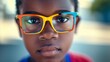 Confident African American child with stylish colorful eyeglasses
