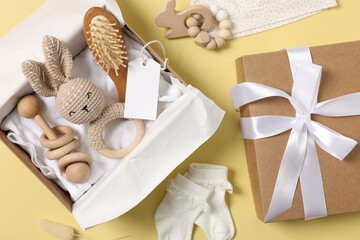 Poster - Flat lay composition with different baby accessories and blank card on yellow background