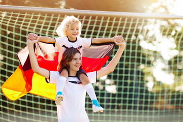 Wall Mural - Germany football fan kids. Children play soccer.