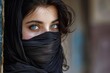 © rushay - Arab girl wearing black shawl covering her face