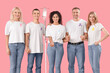 © Pixel-Shot - Young woman undergoing chemical therapy course and people with different awareness ribbons on pink background. World Cancer Day