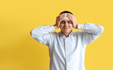 Sticker - Young man with brain concussion and bandaged head on yellow background