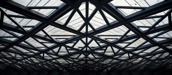 Sticker - Admiring the symmetrical patterns of the metal fixtures on the ceiling, captured in monochrome photography. The parallel lines and triangular shapes create a stunning architectural display