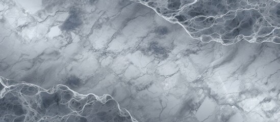 Poster - A closeup of a grey marble texture, resembling cumulus clouds or wind waves in water. The monochrome pattern creates a meteorological phenomenon in darkness, captured in monochrome photography