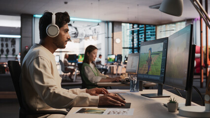 Aufkleber - Indian Male Game Designer Using Desktop Computer With 3D Modelling Software To Design Unique Characters And World For Immersive RPG Video Game. Man Working In Game Development Company Diverse Office