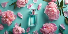 Perfume Bottle With Pink Peony Flowers On A Turquoise Background.
