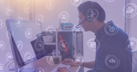 Poster - Image of network of digital icons over businessman using phone headset and computer in office
