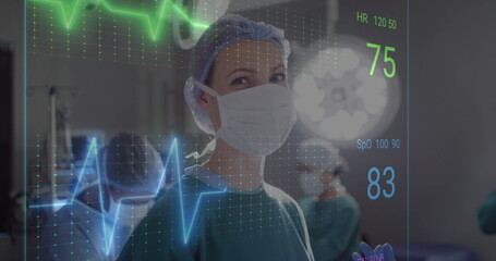 Canvas Print - Image of cardiograph over diverse surgeons operating on patient at hospital