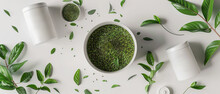 Top View Of A White Bowl Filled With Green Leaves And Herbs Sits On A Table, Calm And Relaxation