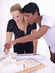 Wall Mural - Model, blueprint or people with engineering teamwork for development project or planning on paper. Architecture, women or group of designers talking in collaboration for floor plan of office building