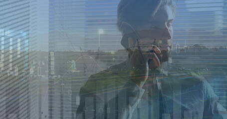 Poster - Image of financial graph over caucasian businessman using smartphone