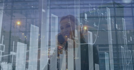 Poster - Image of financial graph over happy caucasian businesswomen using smartphone