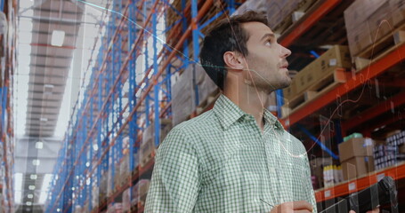 Canvas Print - Image of data processing over man working in warehouse