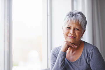 Canvas Print - Portrait, sunshine and window with senior woman, confidence and home with retirement and relaxing. View, old person and pensioner with summer and weekend break with afternoon, aged and happiness