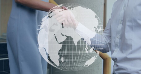 Poster - Digital composite of a Caucasian man and woman doing a handshake by the stairs while a digital globe