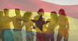Image of waving ghana flag over diverse friends standing and forming chain at beach