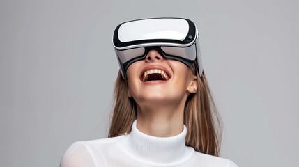 Close-up of young laughing enthusiastic woman wearing white augmented virtual reality glasses on background with copy space.