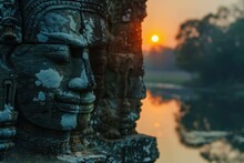 Angkor Thom, Cambodia: Stone Asura Face At Ancient Khmer Temple Ruin With Stunning Sunset Over Moat - Travel And Religion