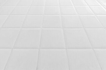 Wall Mural - white tile floor in office.White tiles floor for bedroom , kitchen, bathroom and interior design.White tiles floor in perspective view. Clean and symmetrical surface with grid texture background..