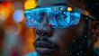 © Zaleman - The young man is wearing smart glasses, a heads-up display, wearable computing, a wearable device, the internet of things, abstract image visuals, video of an abstract image,