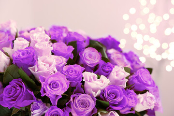 Wall Mural - Bouquet of violet roses against blurred background, closeup. Funeral attributes