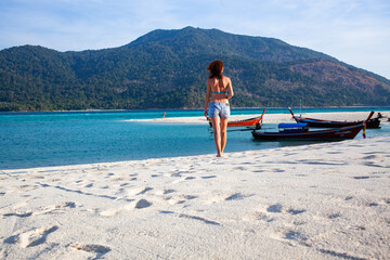 Wall Mural - woman on a tropical beach in Thailand